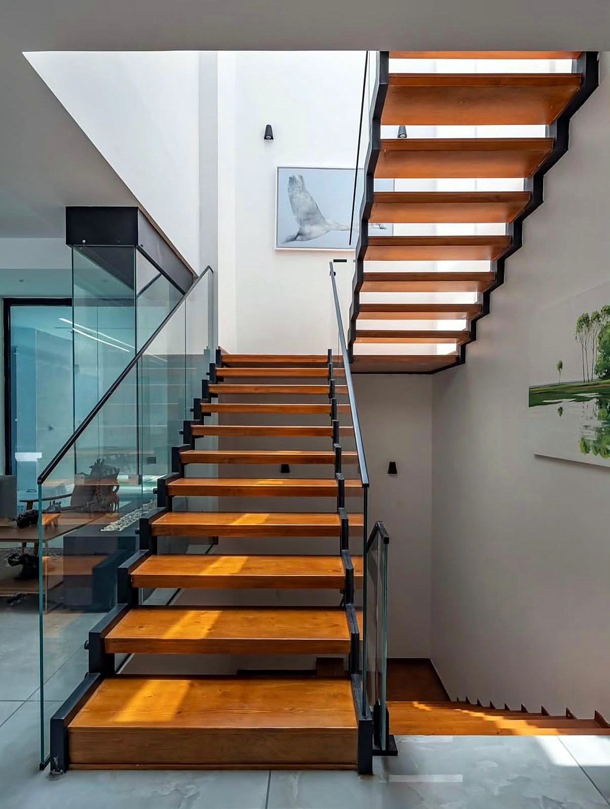 Floating timber stair with glass balustrade