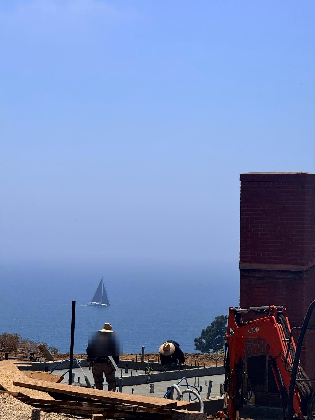 New foundations poured on a cleared coastal lot during the Palisades rebuild