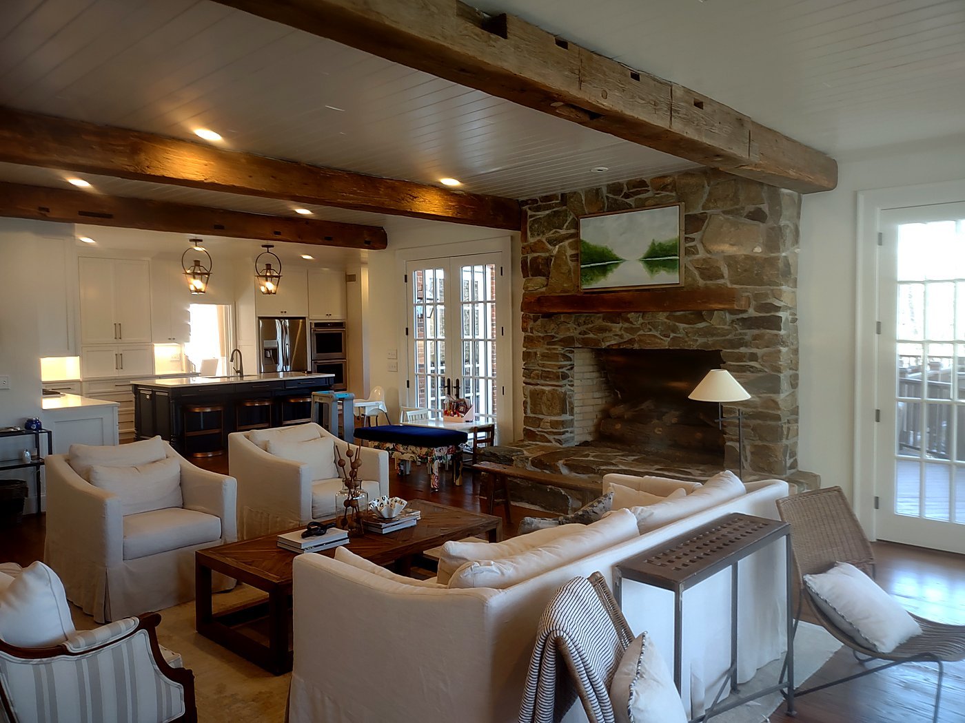 Living room with exposed wood beams and stone fireplace, interior as-built documentation, Atlanta mansion